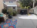 Private backyard with patio, storage shed, and grill at 1655 58Th S Ter # 3, St Petersburg, FL 33712