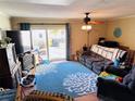 Relaxing living room with sliding glass doors leading to a patio at 1655 58Th S Ter # 3, St Petersburg, FL 33712