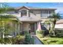 Two story house with dark front door and lush landscaping at 3507 Autumn Glen Dr, Valrico, FL 33596