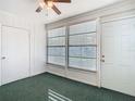Bright sunroom with windows, carpet, and ceiling fan at 4531 Blossom Blvd # 4531, Zephyrhills, FL 33542