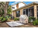 Private patio with grill and spacious flagstone area perfect for outdoor entertaining at 2211 Preservation Dr # 2211, Plant City, FL 33566