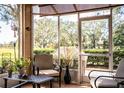 Relaxing screened porch with comfy seating, overlooking a lush green backyard at 2211 Preservation Dr # 2211, Plant City, FL 33566