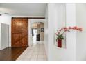 Interior entryway with a rustic barn door and tiled floor at 269 Fairmont Dr, Spring Hill, FL 34609