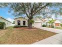 House exterior showcasing a well-maintained lawn and driveway at 269 Fairmont Dr, Spring Hill, FL 34609