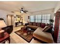 Spacious living room featuring a sectional sofa and tile floors at 10937 N Lantana Ave, Tampa, FL 33612