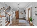 Open entryway, hardwood floors, and a rustic barn door at 3011 39Th E St, Bradenton, FL 34208