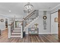 Elegant staircase with metal railings and hardwood floors at 3011 39Th E St, Bradenton, FL 34208