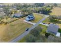 Aerial view of the house and surrounding neighborhood at 14818 Grady Sweat Ln, Wimauma, FL 33598