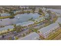 Wide aerial showcasing community by the lake at 190 Pompano Se Dr # A, St Petersburg, FL 33705