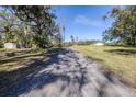 Gravel driveway through a wooded area at 1944 Sparkman Rd, Plant City, FL 33566