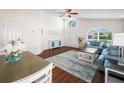 Living room with light blue sofa and wood-look floors at 4512 Preston Woods Dr, Valrico, FL 33596