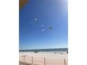 Beachfront property with kites in the air at 14900 Gulf Blvd # 113, Madeira Beach, FL 33708