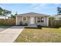 Inviting single-story home featuring a neat front yard and classic design elements at 3415 N 53Rd St, Tampa, FL 33619