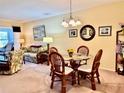 Dining area features a round glass table with four chairs at 936 Virginia St # 208, Dunedin, FL 34698