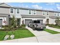 Charming townhome with one-car garage, landscaped front yard, and plenty of curb appeal at 11658 Bluestone Ct, Parrish, FL 34219