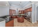 Spacious kitchen featuring granite countertops and stainless steel appliances at 5515 Reisterstown Rd, North Port, FL 34291