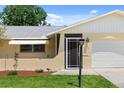 Front entrance with a screened porch and updated door at 566 Viridian St, Englewood, FL 34223