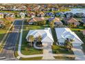 Aerial view of two homes, showcasing neighborhood and waterfront at 664 Silk Oak Dr, Venice, FL 34293