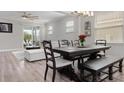 Bright dining room with a large table and access to the living room at 11684 Renaissance Blvd, Venice, FL 34293