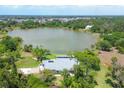 Aerial view of house near lake at 5885 Denison Dr, Venice, FL 34293