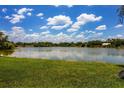 Serene view of a lake with lush greenery at 5885 Denison Dr, Venice, FL 34293