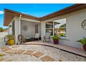 Relaxing patio area with seating and potted plants at 270 Capri Ave, Venice, FL 34293