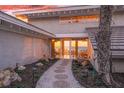 Ocean view pathway leads to home entrance, with landscaping and lighting at 5 N Casey Key Rd, Osprey, FL 34229