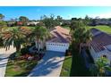 Home's exterior and surrounding landscape from above at 1342 Capri Isles Blvd # 14, Venice, FL 34292