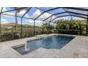 Inviting screened pool with fountain and travertine deck at 13240 Amerigo Ln, Venice, FL 34293