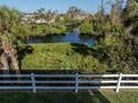 Scenic waterfront property with lush vegetation and a private boardwalk at 841 Waterside Dr # 206, Venice, FL 34285