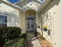 Inviting entryway with double doors and decorative metal trellis at 25 Windsor Dr, Englewood, FL 34223