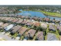 Aerial view of a house in a residential neighborhood at 620 Lakescene Dr, Venice, FL 34293