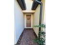 Brick walkway leading to the front door of the house at 2501 Sherman Oak Dr, North Port, FL 34289