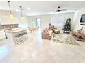 Open floor plan with kitchen, living area, and dining space at 2501 Sherman Oak Dr, North Port, FL 34289