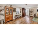 Living room with hardwood floors, antique furniture, and decor at 2191 Park Rd, Venice, FL 34293