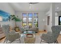 Bright living room with a neutral color palette and ample natural light at 5003 Southern Pine Cir, Venice, FL 34293