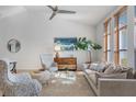 Spacious living area with light walls, comfortable seating, and large windows at 5003 Southern Pine Cir, Venice, FL 34293