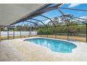 Screened-in pool area with tiled deck at 5296 Rolla Rd, Venice, FL 34293