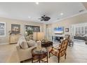 Bright living room with comfortable furniture and view to backyard at 21208 Sandal Foot Dr, Venice, FL 34293