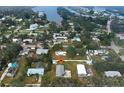 Aerial view of a neighborhood near a river and lush greenery, highlighting the home's location at 215 Portia N St, Nokomis, FL 34275