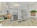 Modern kitchen with stainless steel appliances and granite countertops at 9847 Haze Dr, Venice, FL 34292