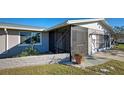 Screened porch entrance with brick planter at 1358 Leawood Rd, Englewood, FL 34223