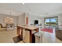 Modern kitchen island with granite countertop and stainless steel appliances at 17108 Vardon Ter # 308, Bradenton, FL 34211