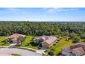 Stunning aerial view showcasing the home's private setting and neighborhood at 19718 Cobblestone Cir, Venice, FL 34292