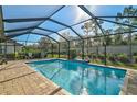 Refreshing screened pool perfect for outdoor entertaining at 232 Benedetto Ct, Nokomis, FL 34275