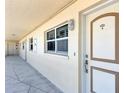 Building hallway with light-colored walls and doors at 255 The Esplanade N # 603, Venice, FL 34285