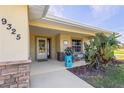 Inviting front porch with seating area, perfect for relaxing outdoors at 9325 Crugar Ter, Englewood, FL 34224