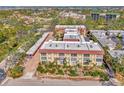 Condo building with a view of the surrounding area and landscaping at 101 Park S Blvd # 111, Venice, FL 34285