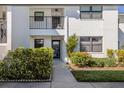 Inviting condo entrance with lush landscaping at 1100 Capri Isles Blvd # 212, Venice, FL 34292