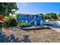 Charming blue house with boat and landscaped yard at 113 Colonia W Ln, Nokomis, FL 34275